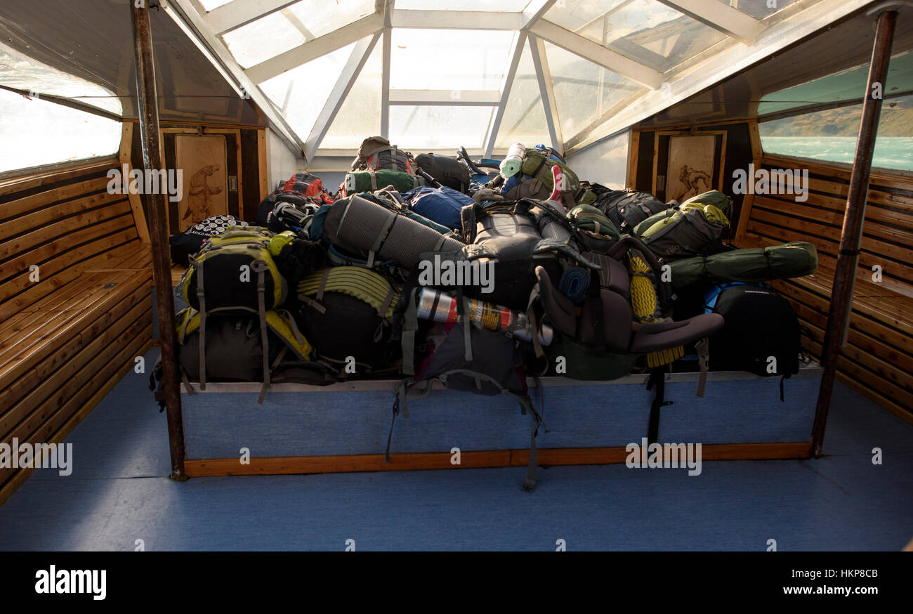 Backpacks on catamaran between Refugio Pudeto and Refugio Paine Grande in Torres del Paine National Park, Chile. Stock Photo