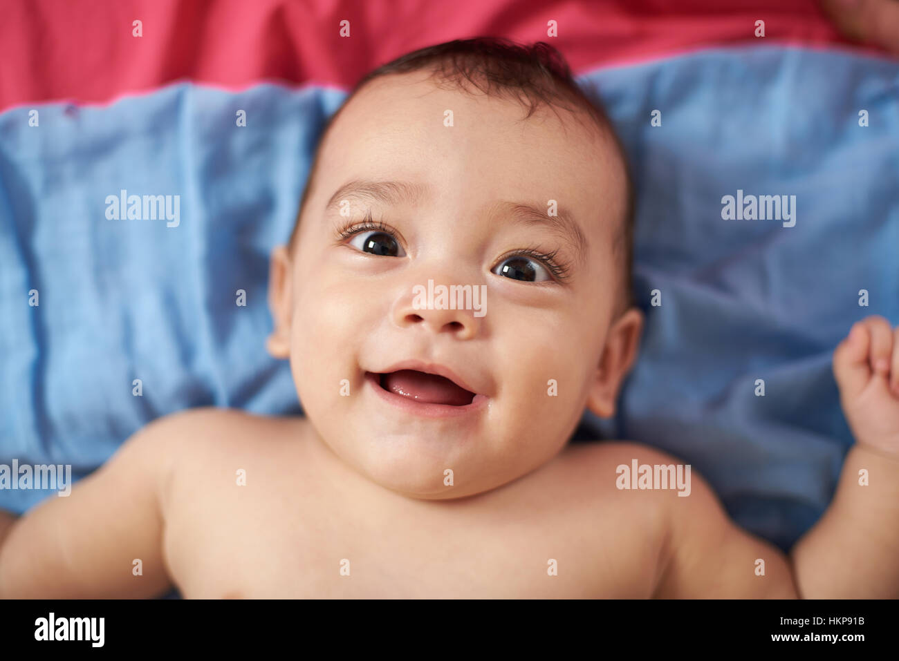 baby portrait laying on bed view from top Stock Photo Alamy