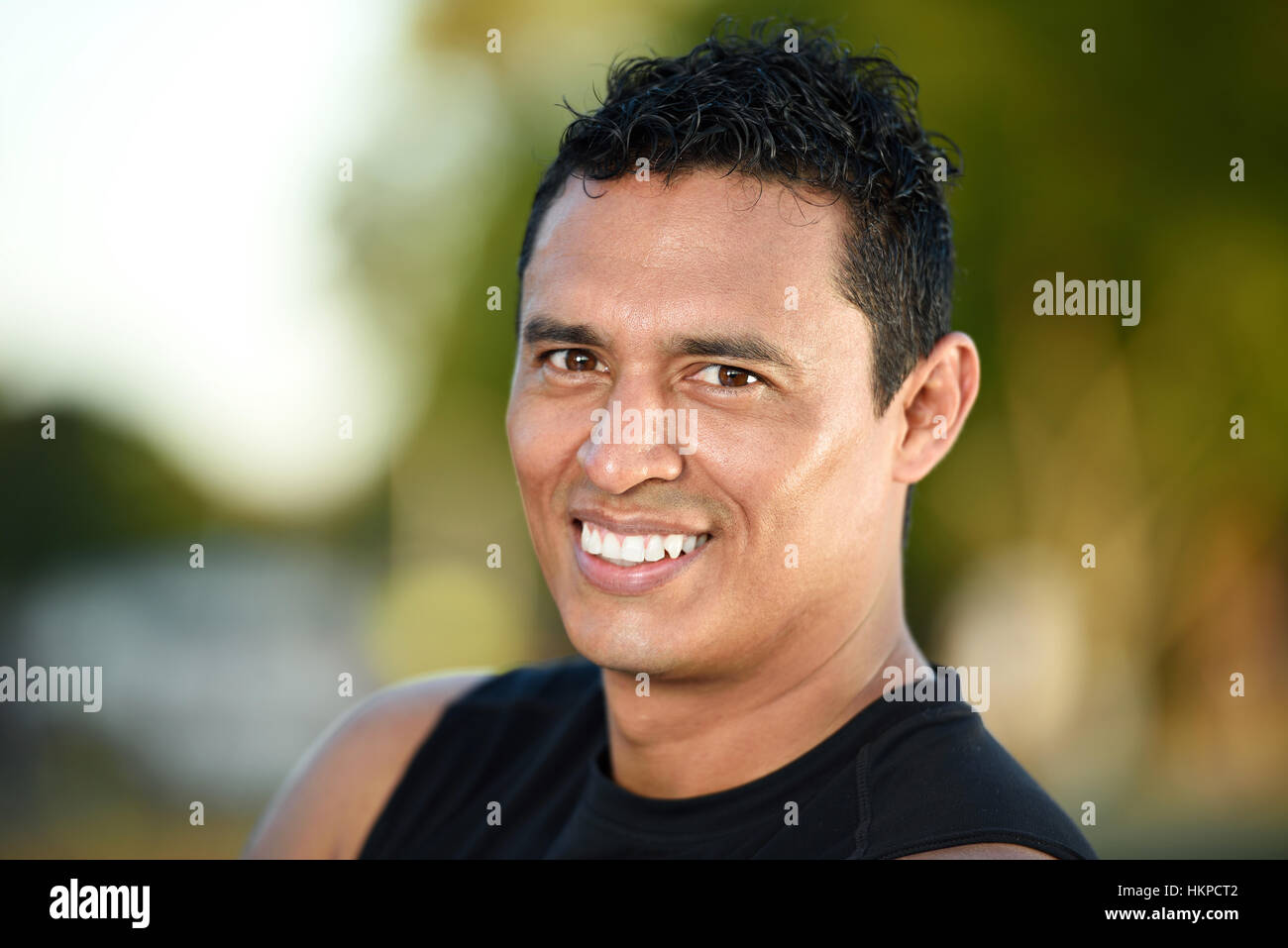 sporty smile fresh man portrait on green background Stock Photo