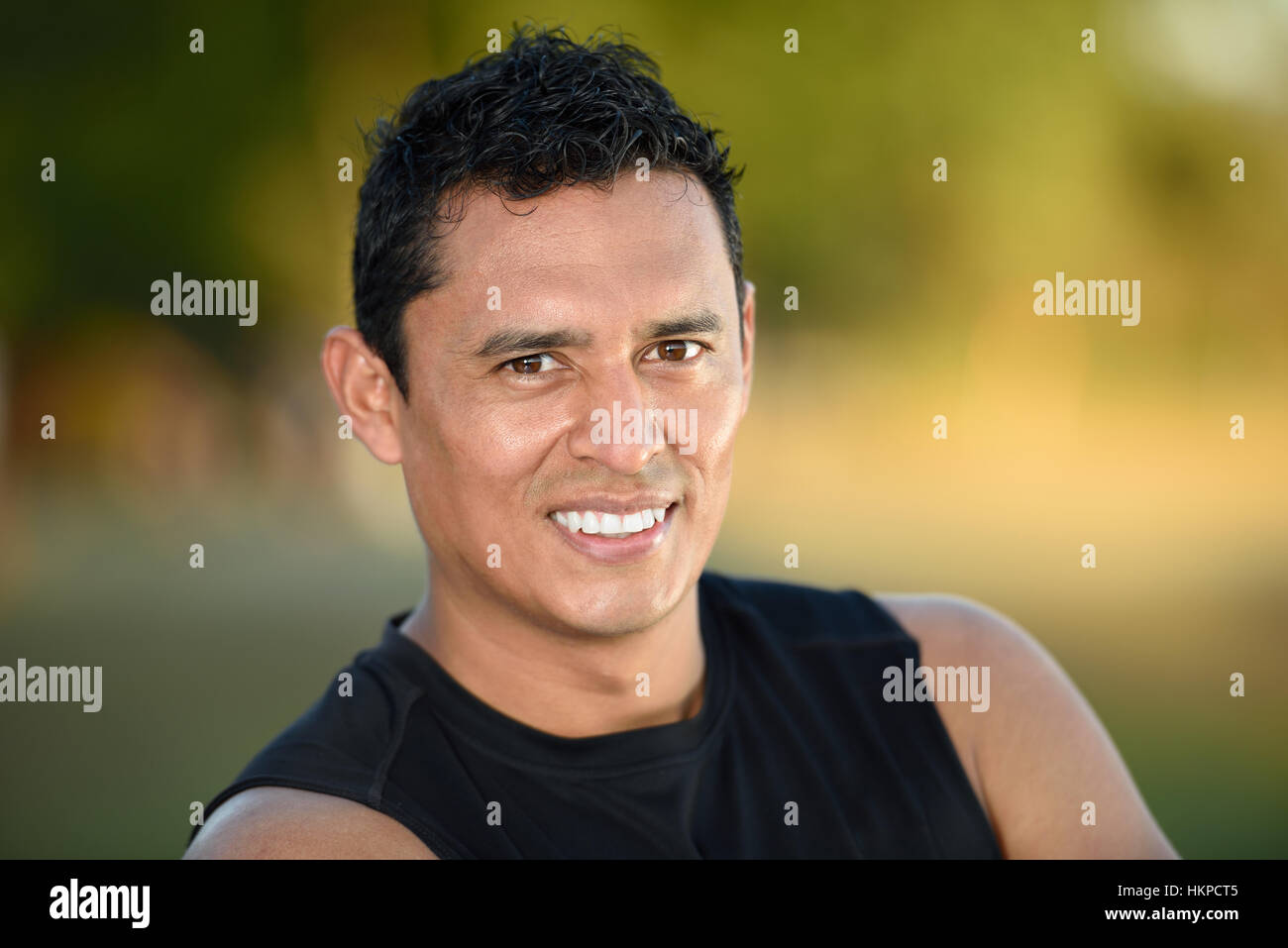 portrait sport man on black shirt on blurred background Stock Photo