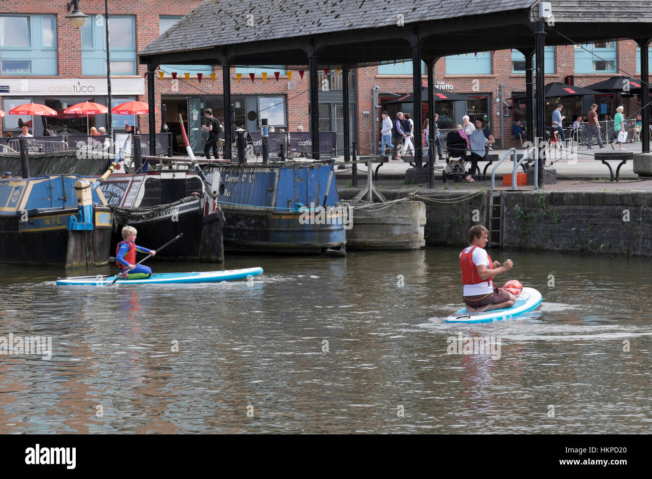 Paddle boarding in Gloucester docks Stock Photo Alamy