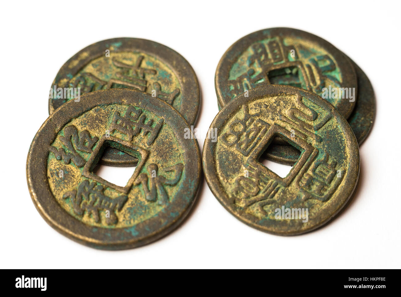 Ancient bronze coins of China on over white Stock Photo
