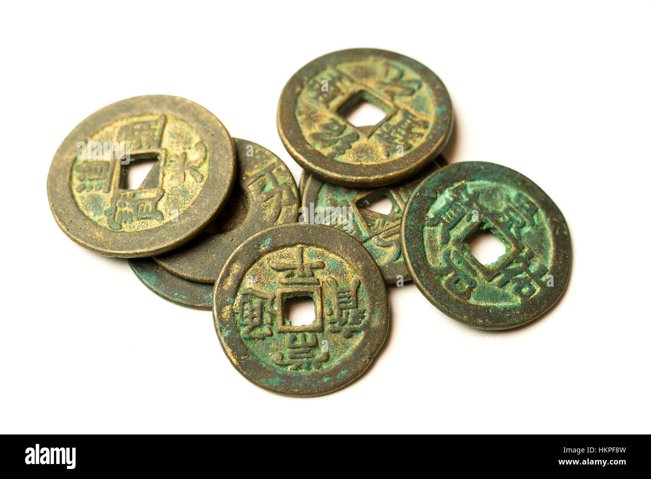 Ancient bronze coins of China on over white Stock Photo