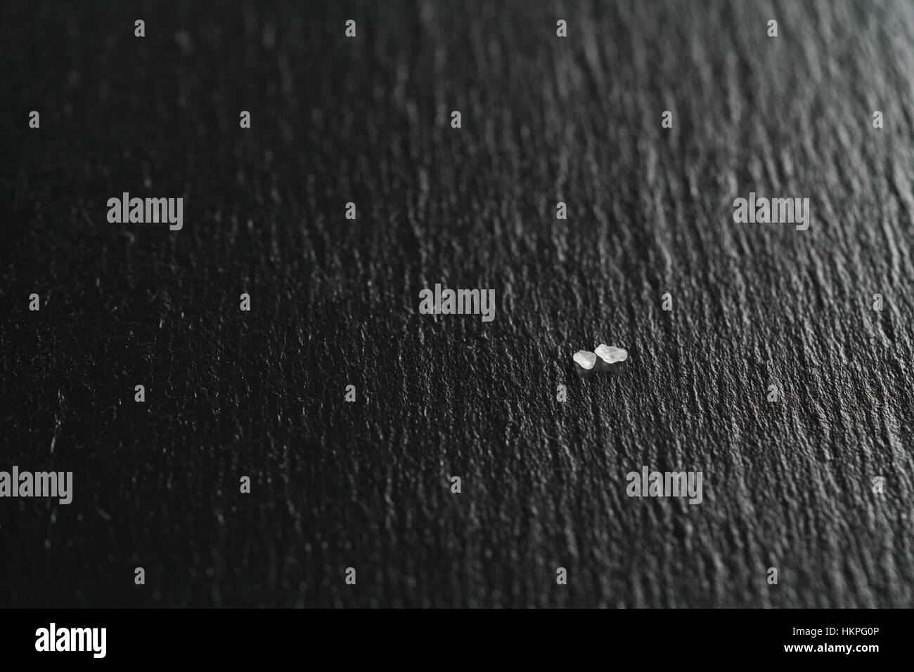 coarse sea salt crystals on slate background Stock Photo Alamy