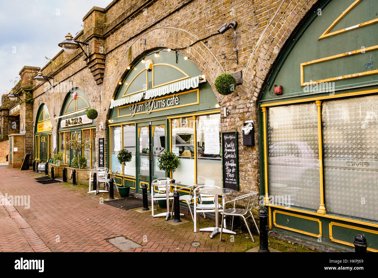 Shops and Cafes occupying space under railway arches, Mill Row, Bexley