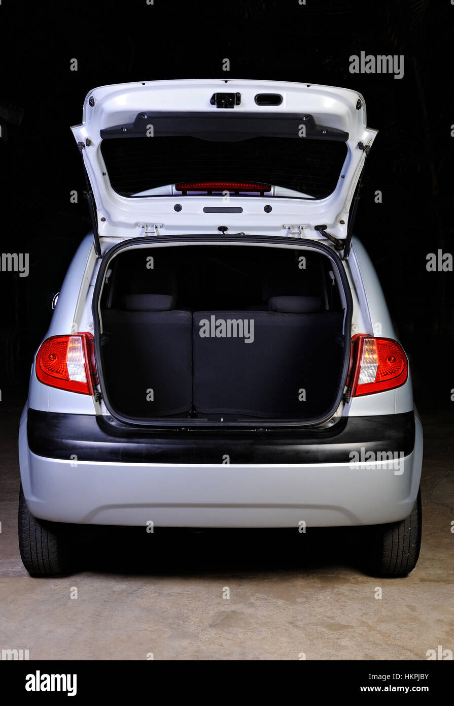 open empty trunk of hatchback isolated on black Stock Photo Alamy
