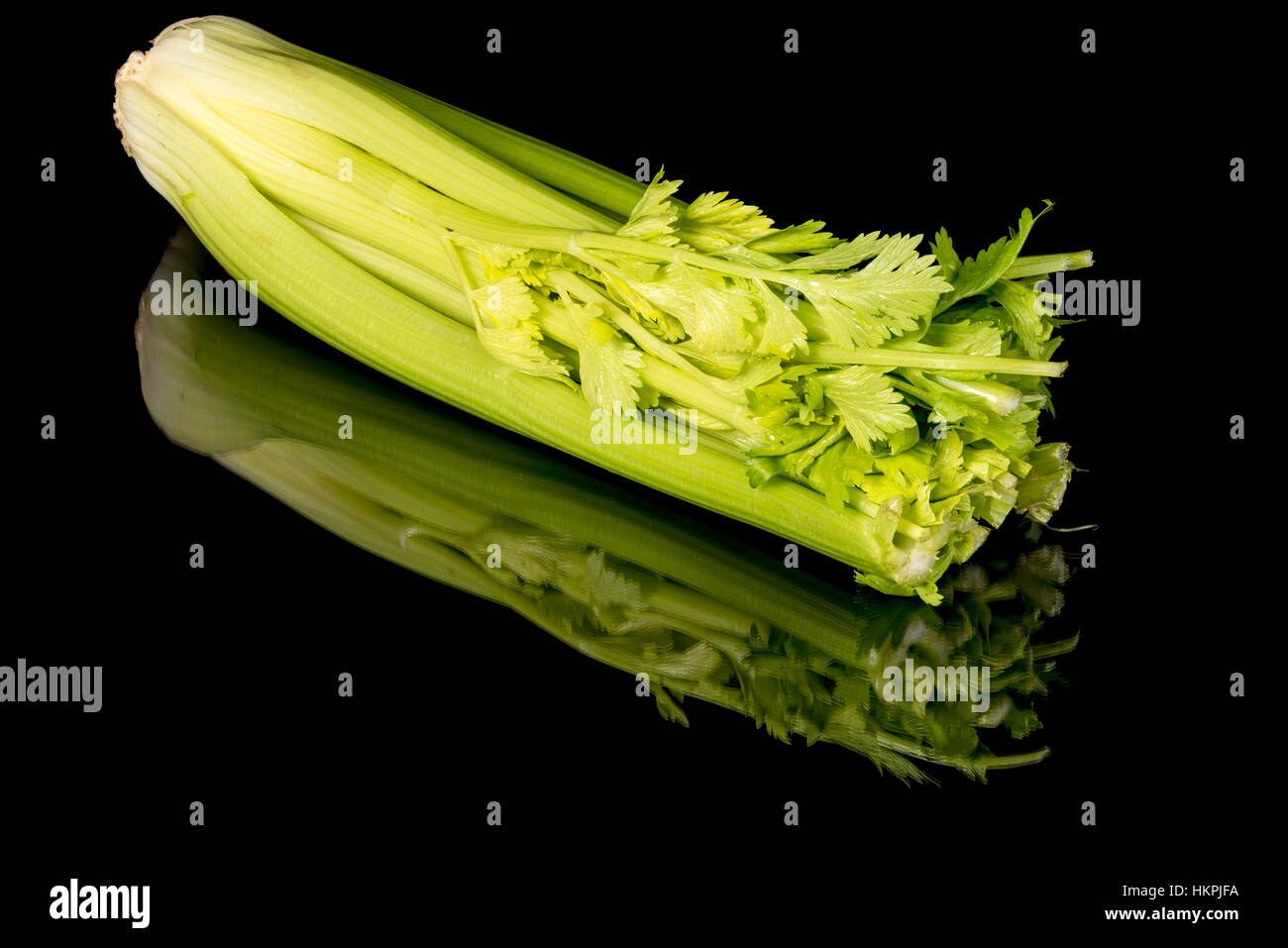 Stalks of fresh celery with some leaves still on it Stock Photo