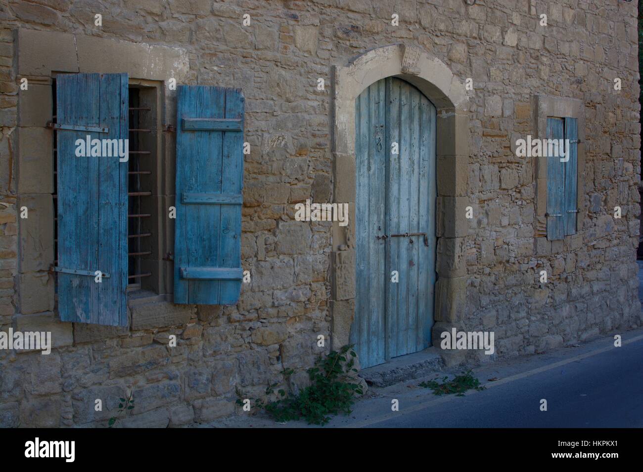 Blue rustic wooden shutters and door Stock Photo - Alamy