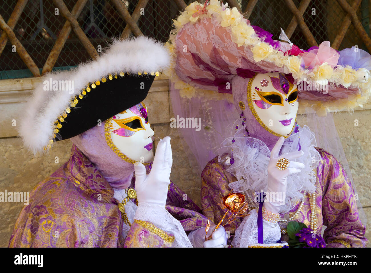 People with mask and fancy dress in carnival. Stock Photo