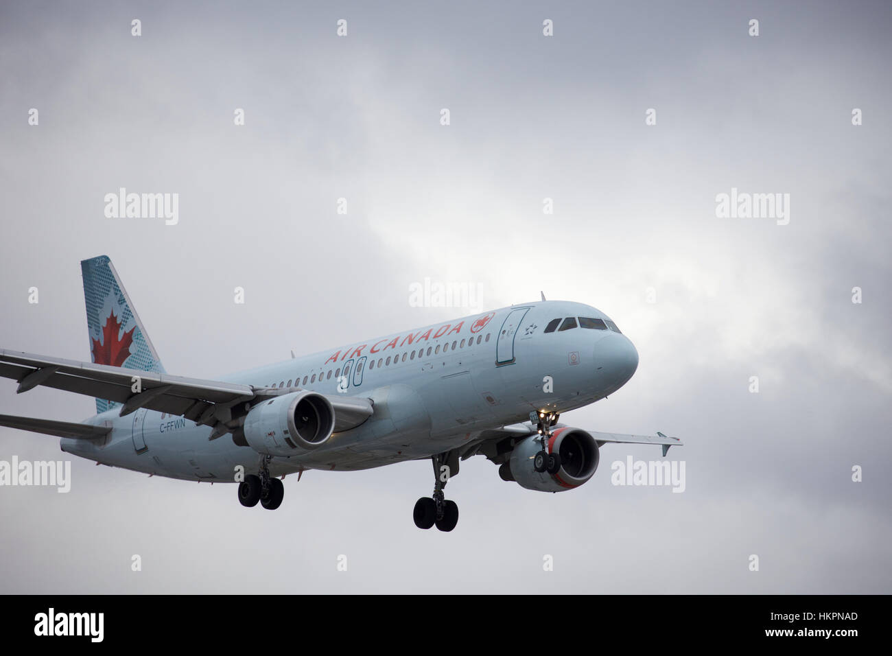 Air Canada Airbus 320 with Red Engine nacelle  Landing at Toronto Pearson Airport on Runway 23L Stock Photo