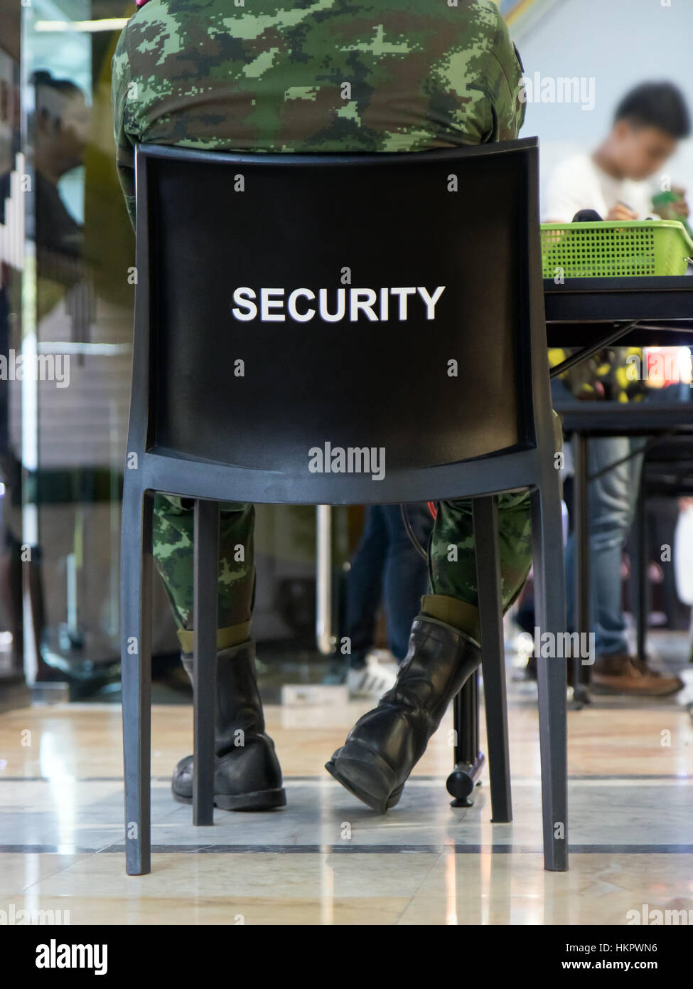 Security guard sitting on chair hi-res stock photography and images - Alamy