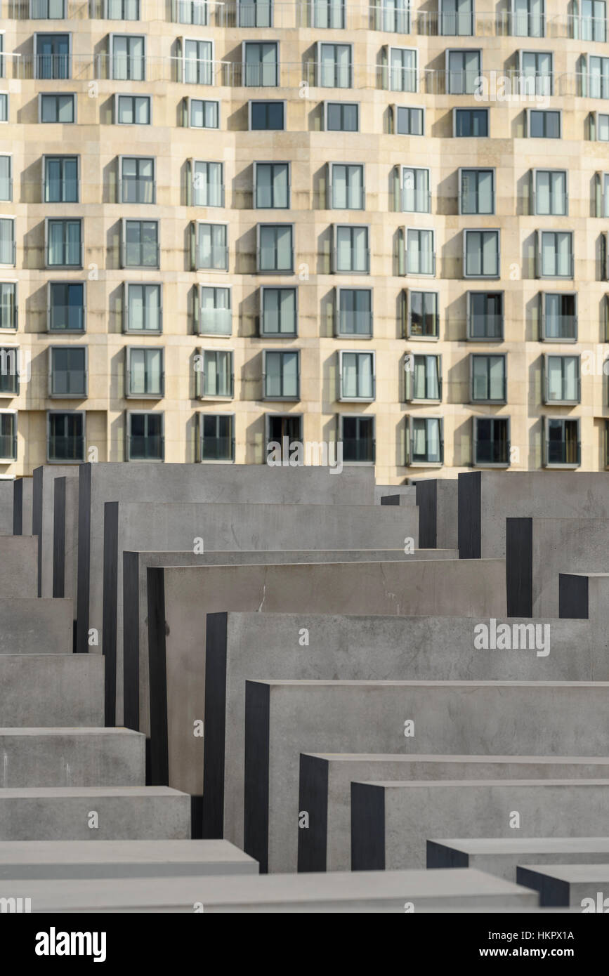 Berlin. Germany. The Behrenstraße facade of DZ Bank building, and the Memorial to the Murdered Jews of Europe. Stock Photo