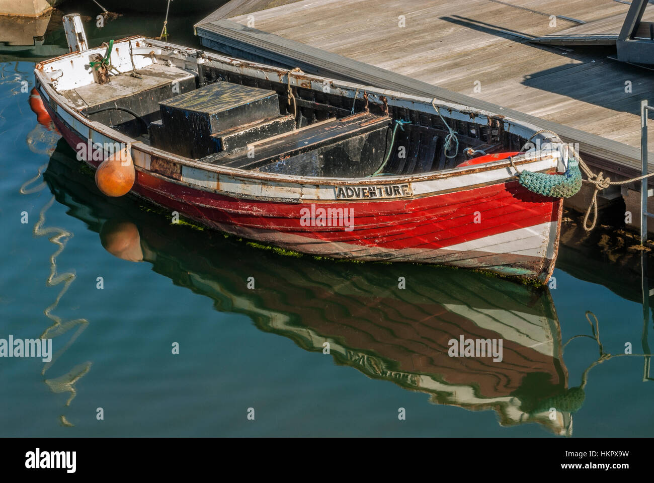 Small red Fishing Boat, named 'Adventure' in the Harbour of Scarborough on the North Sea coast of North Yorkshire, England Stock Photo