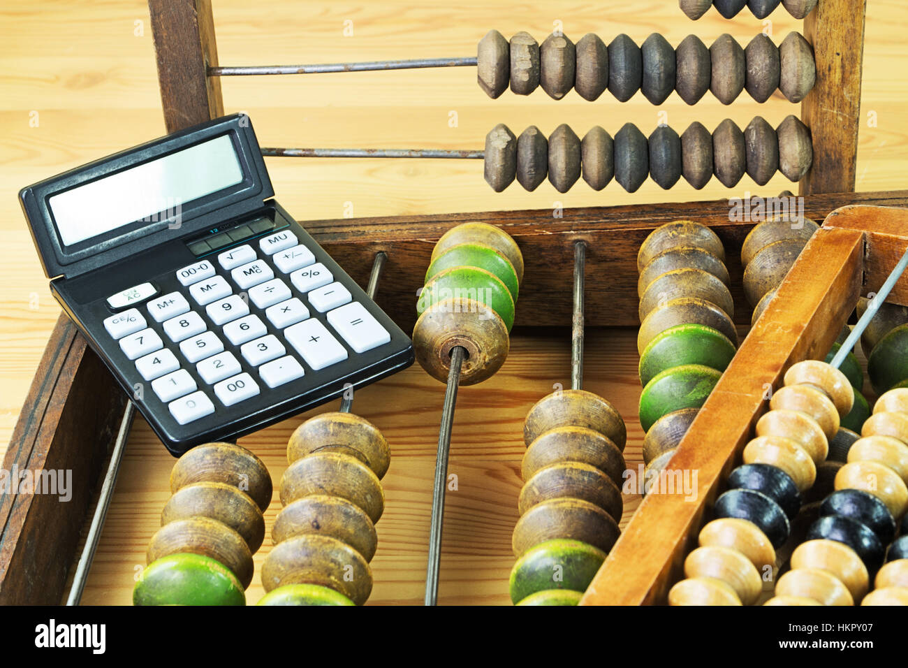 Old wooden abacus and the calculator Stock Photo
