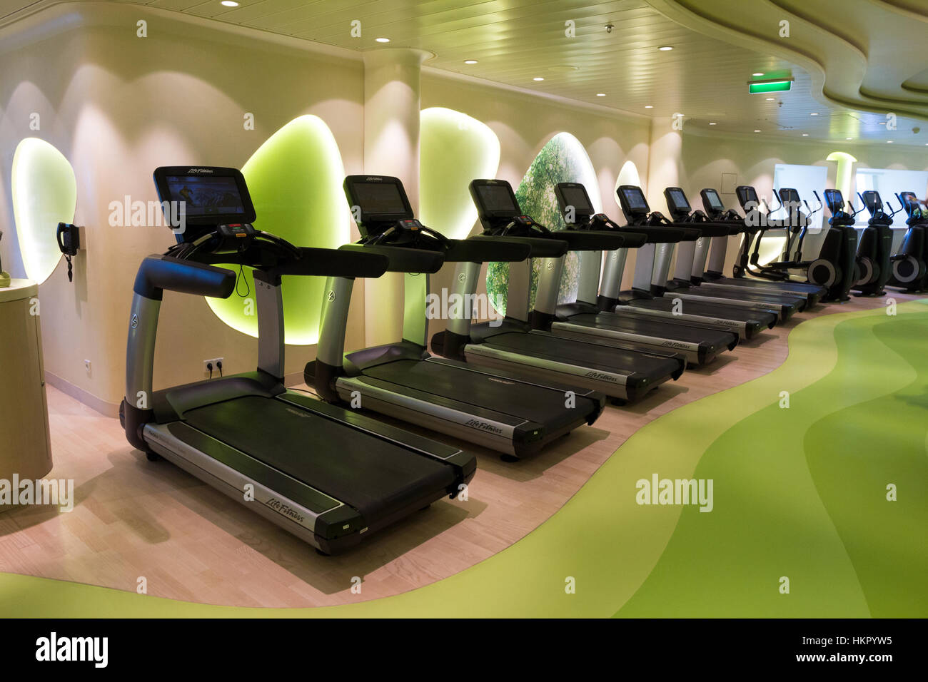 ROTTERDAM - NOV 24, 2016: Row of treadmills in the fitness center on board of the AIDAprima cruise ship. Stock Photo