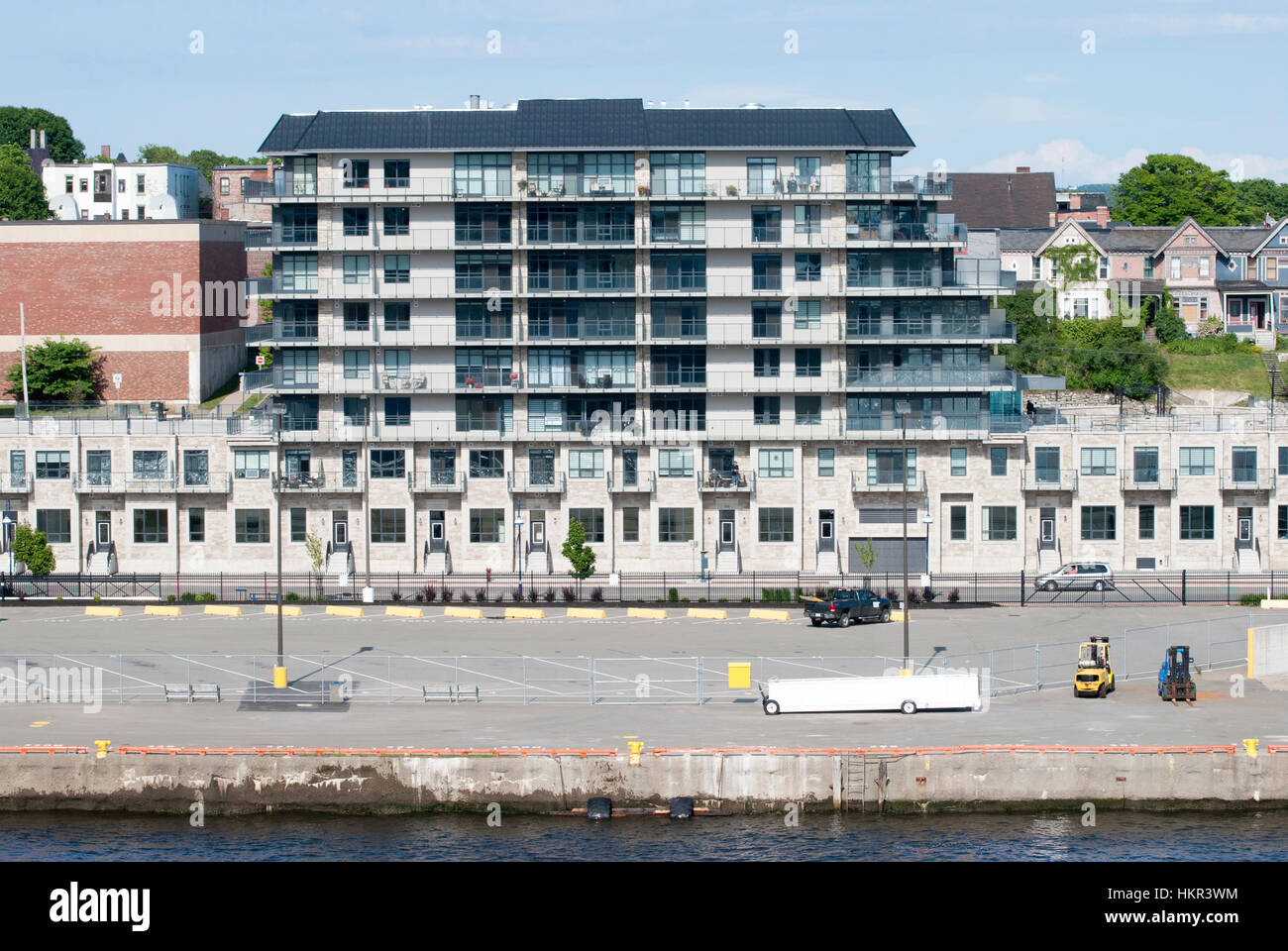 The modern apartment building standing in front of the bay in Saint