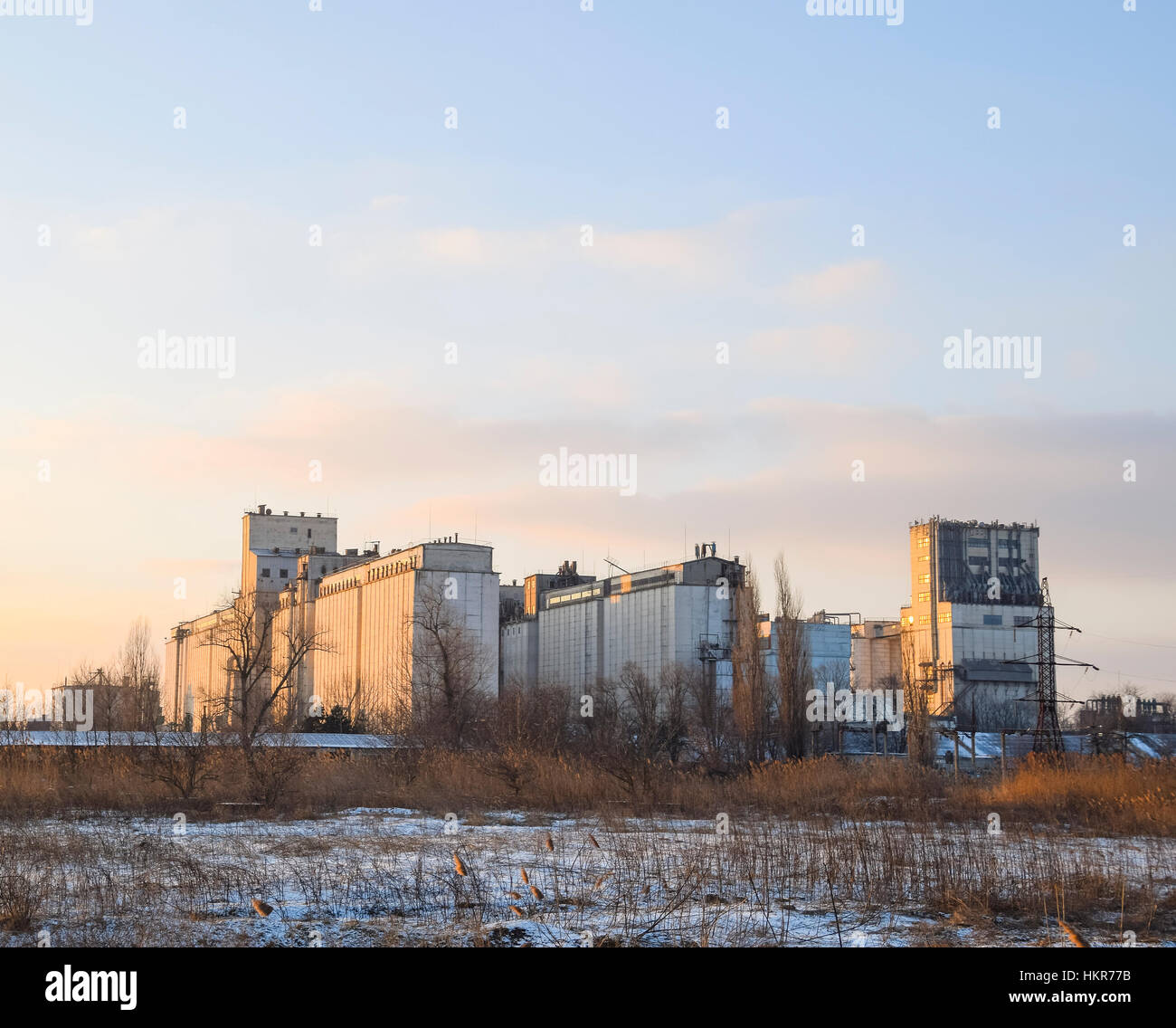 Building for storing and drying grain. Soviet-built elevator. Stock Photo
