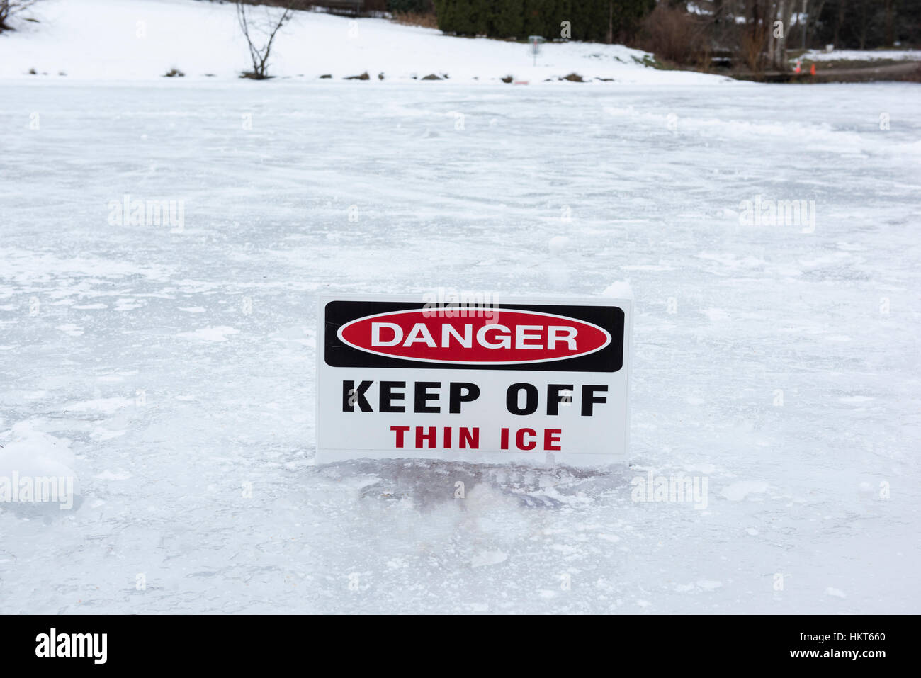 Danger sign warning of thin ice. Stock Photo