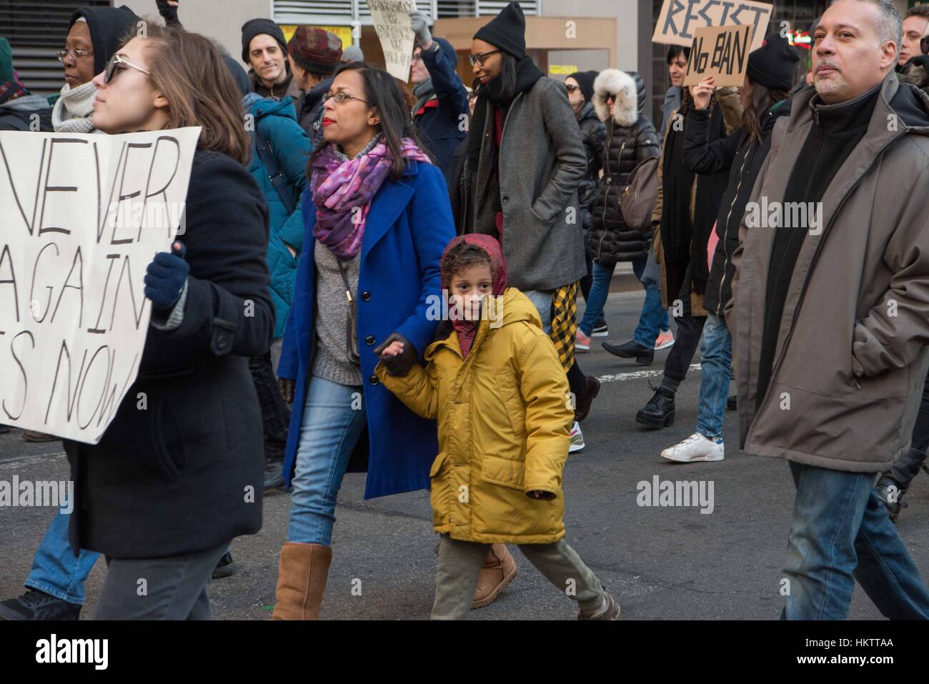 New York City, USA. 29th Jan, 2017. Protestors and marches at a rally to support immigrants and express outrage in the wake of President Donald Trump's ban on immigrants and Muslims to the United States. The march started wwith a rally in Battery Park, near the Statue of Liberty and marched uptown with thousands of people. Credit: Brigette Supernova/Alamy Live News Stock Photo