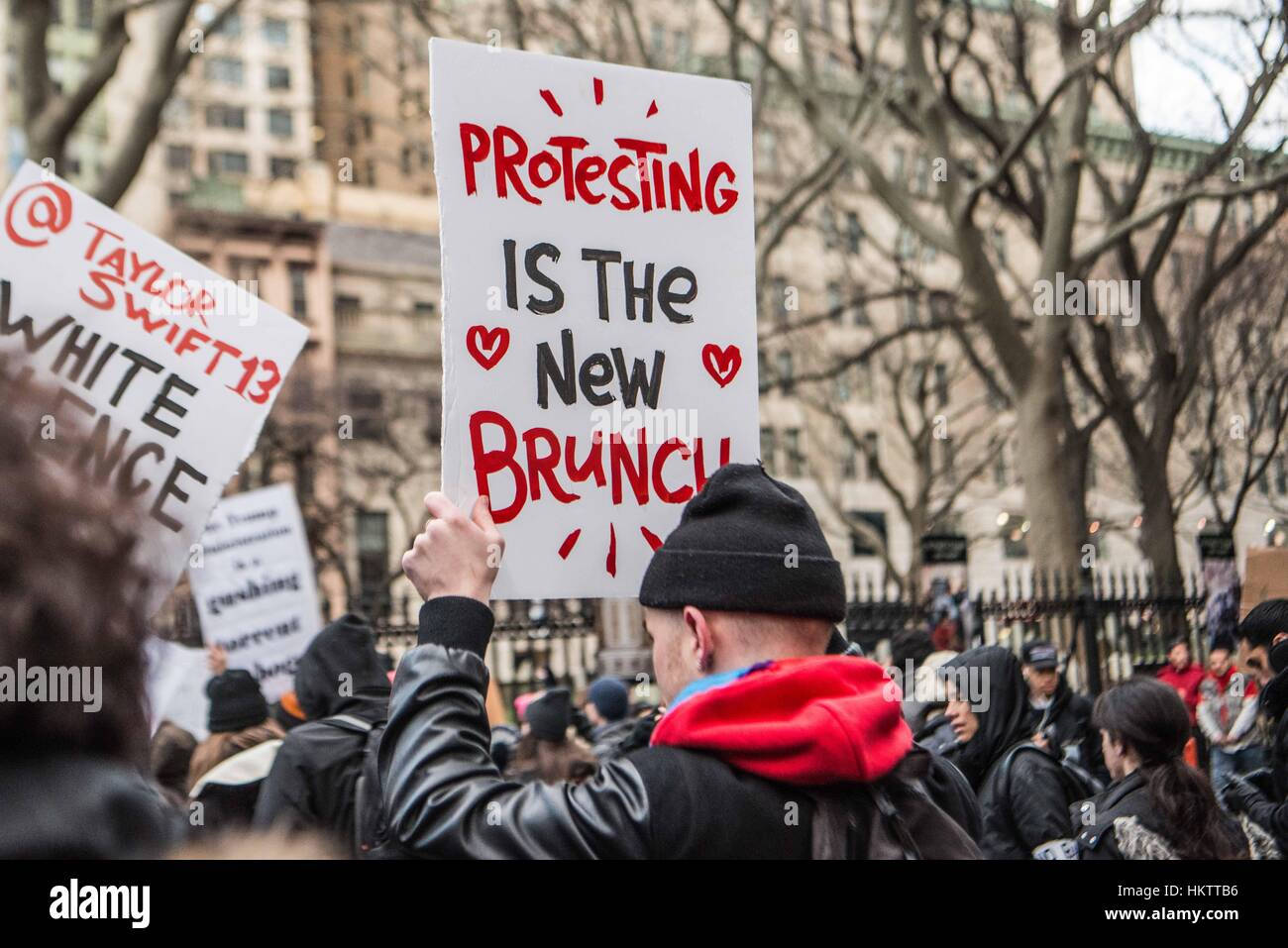 New York City, USA. 29th Jan, 2017. Protestors and marches at a rally to support immigrants and express outrage in the wake of President Donald Trump's ban on immigrants and Muslims to the United States. The march started with a rally in Battery Park, near the Statue of Liberty and marched uptown with thousands of people. Credit: Brigette Supernova/Alamy Live News Stock Photo