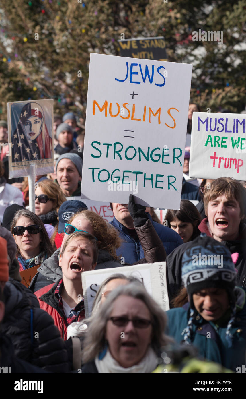 Boston, Massachusetts, USA. 29th January, 2017.  More than 20,000 demonstrators filled Copley Square in central Boston protesting U.S. President Donald Trump’s executive order stopped immigration from Iran, Iraq, Yemen, Somalia, Sudan, Libya and Syria to the United States.    Several thousand of the demonstrators then walked a mile through the city center to the Massachusetts State House where the chanted for the state governor.  The demonstration in Copley Square was organized by the Massachusetts branch of the Council on American-Islamic Relations, CAIR.   Credit: Chuck Nacke/Alamy Live News Stock Photo
