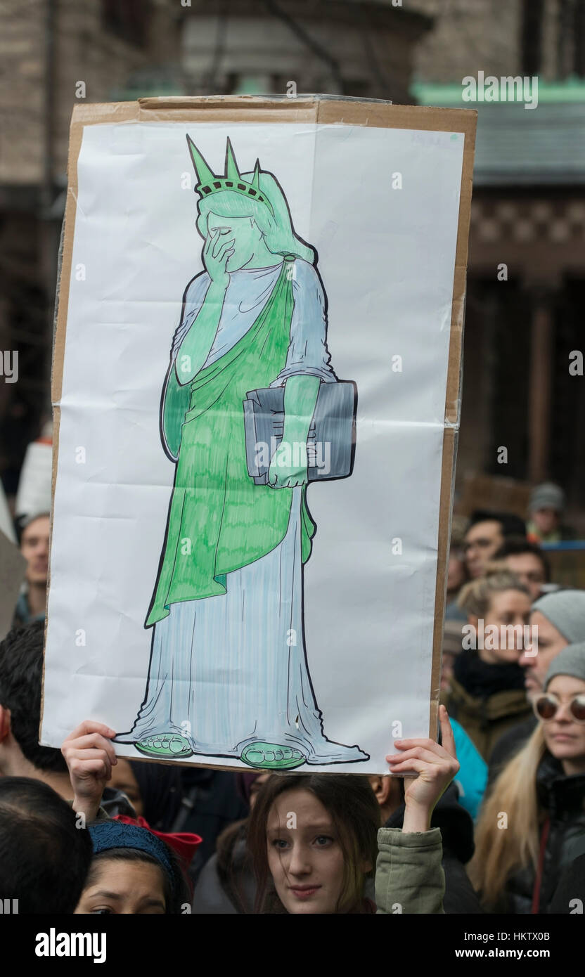 Boston, Massachusetts, USA. 29th January, 2017.  More than 20,000  demonstrators filled Copley Square in central Boston protesting President Donald Trump’s executive order stopped immigration from Iran, Iraq, Yemen, Somalia, Sudan, Libya and Syria to the United States. American-Islamic Relations, CAIR.  Photo shows a woman in Copley Square holding a illustration of a weeping Statue of Liberty  Credit: Chuck Nacke/Alamy Live News Stock Photo