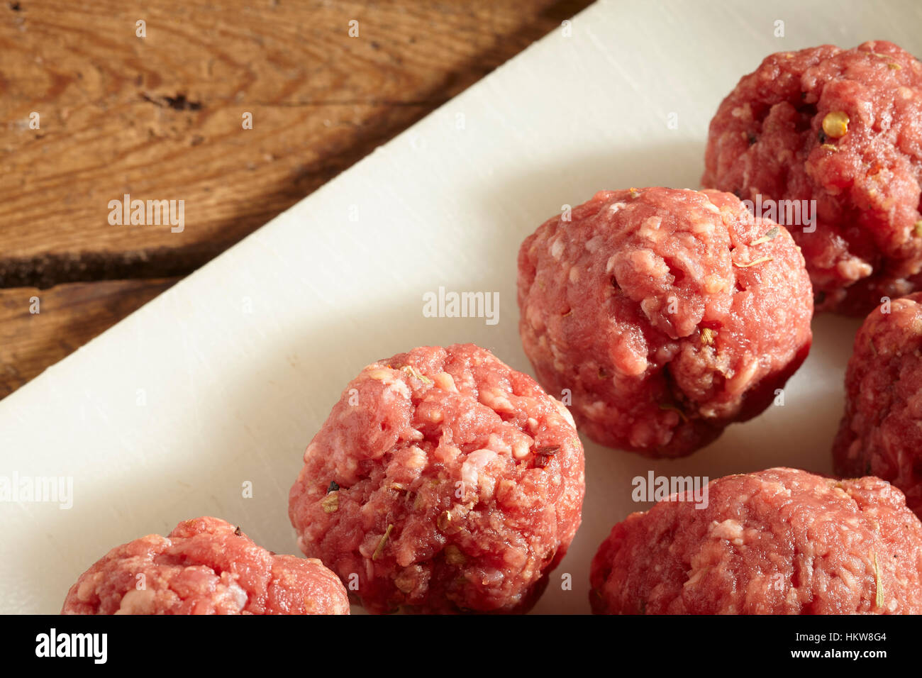 seasoned raw beef meatballs, ready for cooking Stock Photo Alamy