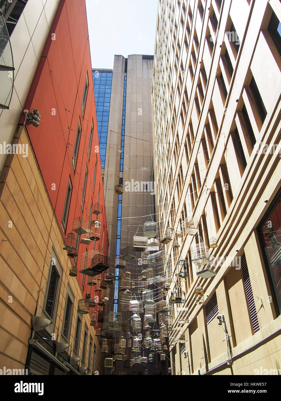 Bird cages hang between skyscrapers in downtown Sydney, Australia Stock