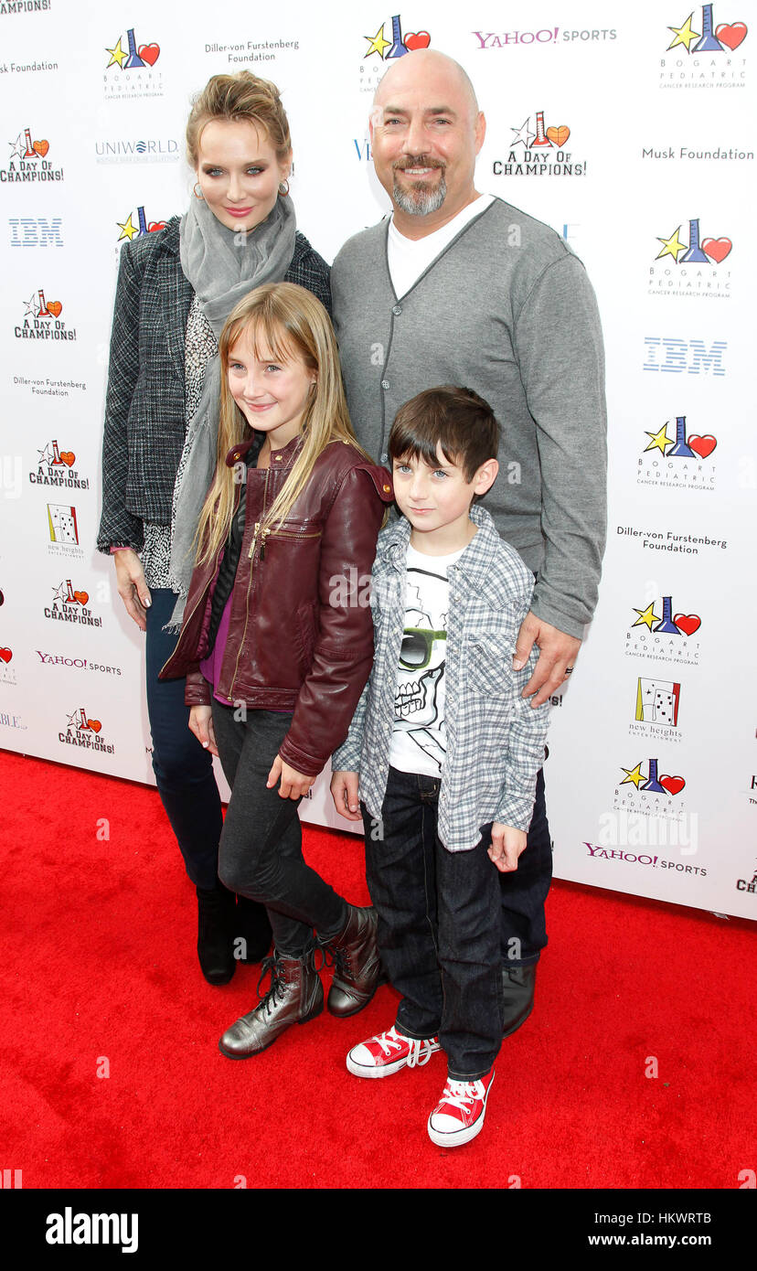 Agent Adam Venit, wife, Trina Venit with their children Olivia and Matthew arrive at the Yahoo