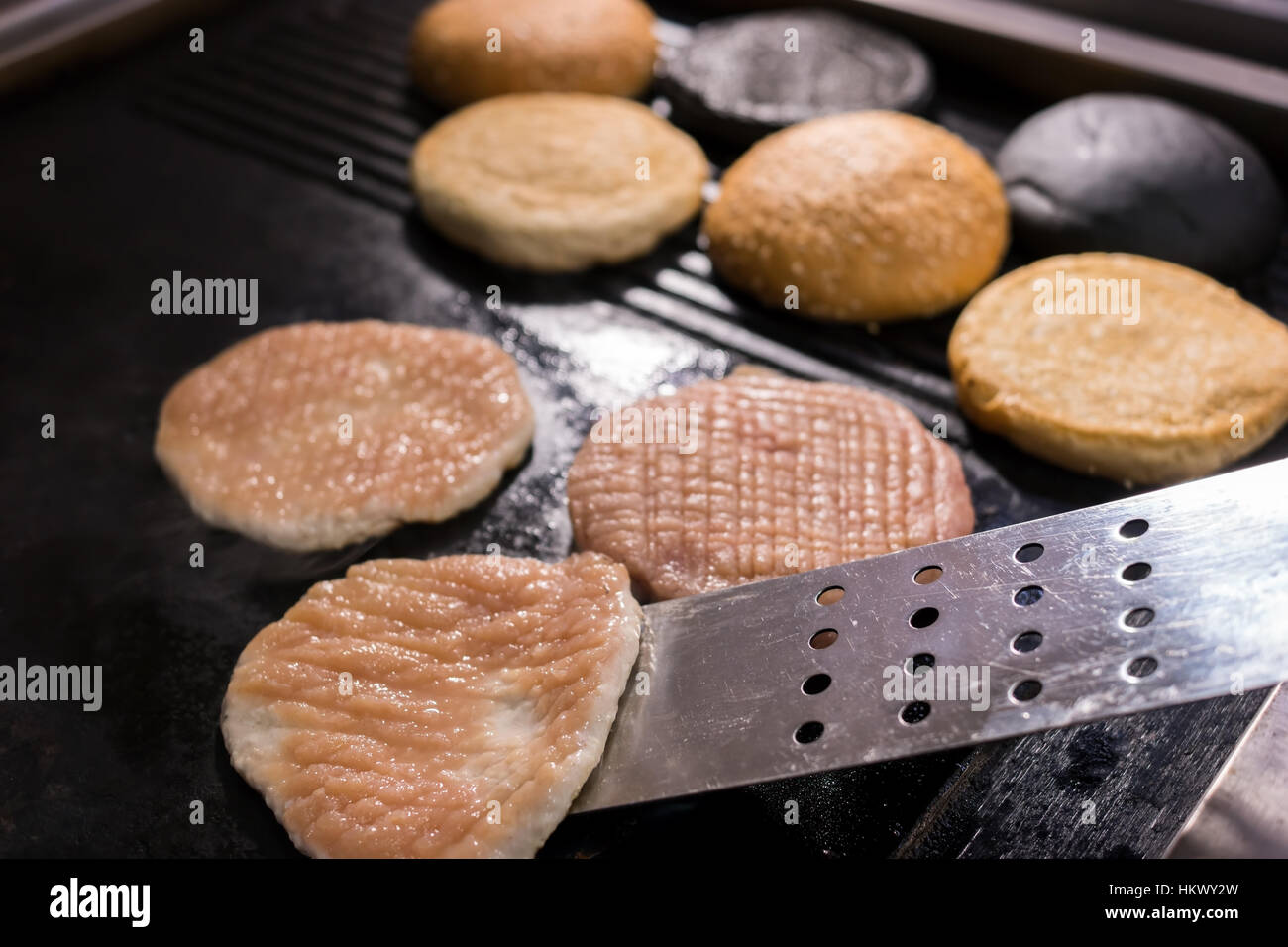 Spatula and burger meat. Stock Photo