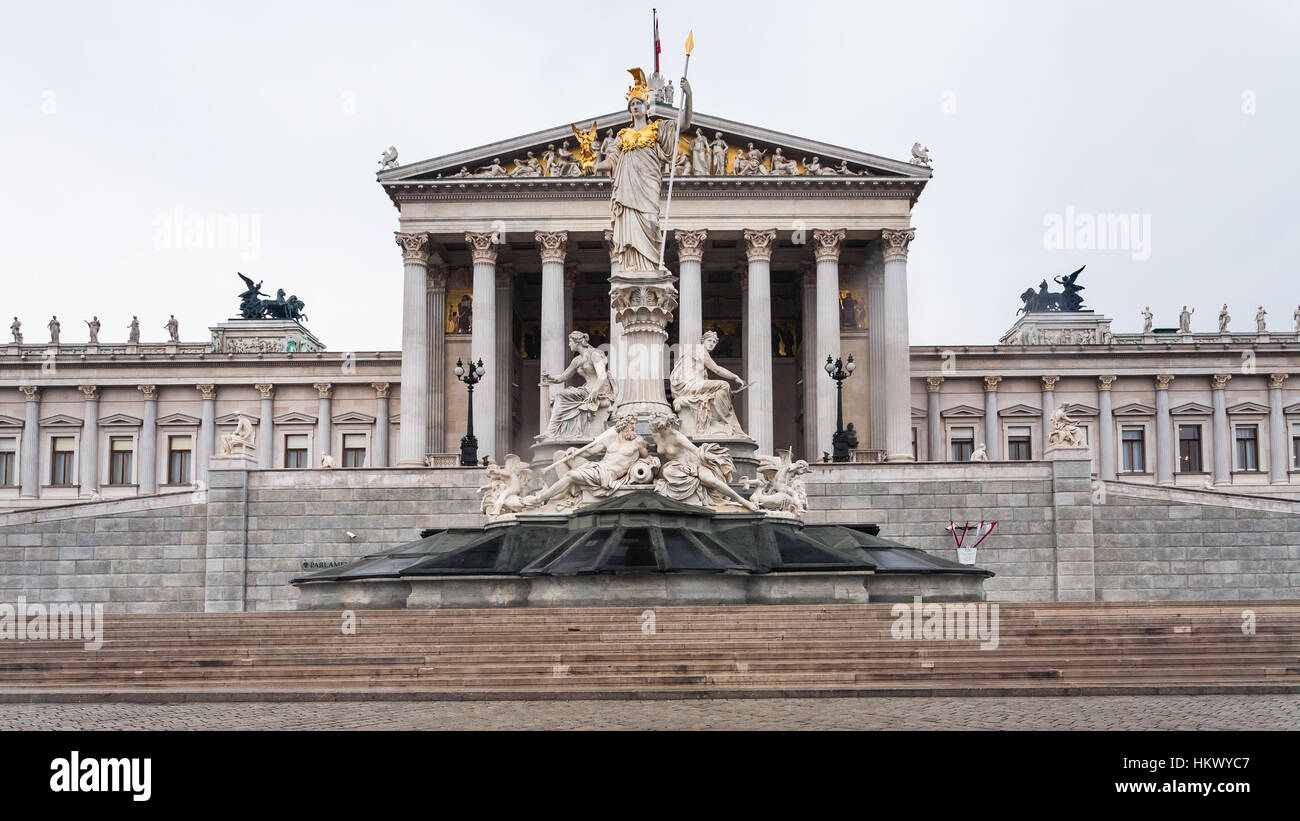 front view of Athena Pallas fountain and Austrian Parliament Building in Vienna city in spring Stock Photo
