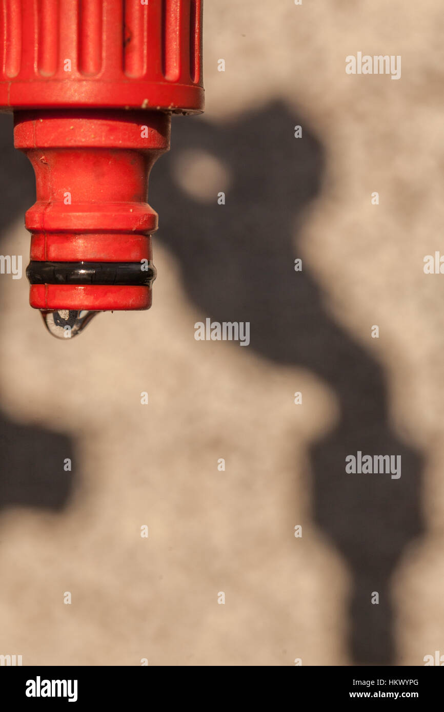 Water dripping from a garden hose Stock Photo Alamy