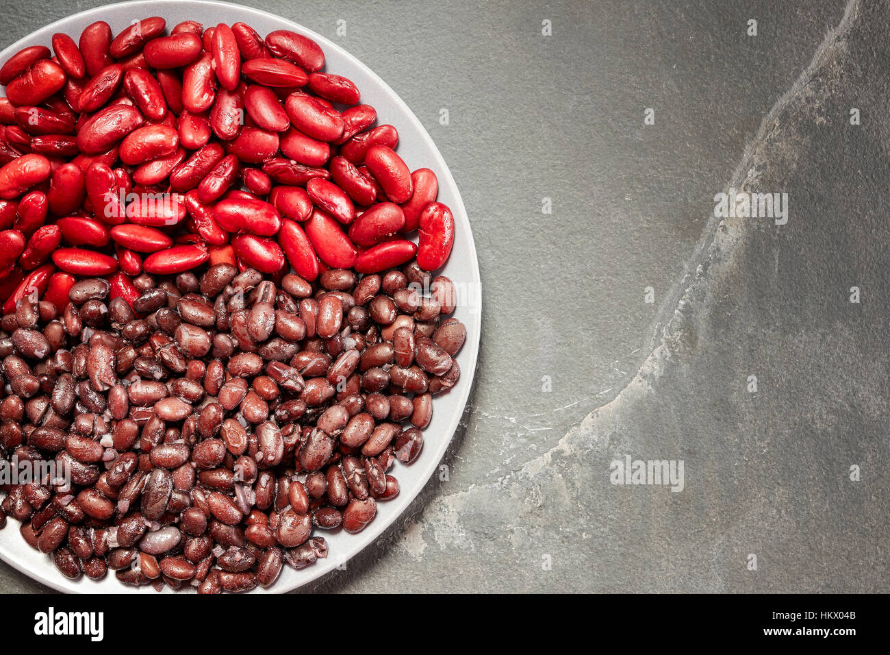 Cooked red kidney and black bean on a plate, copy space Stock Photo Alamy