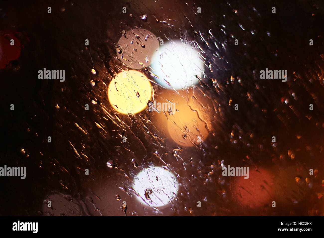 city blurred lights through rainy drops on window Stock Photo - Alamy