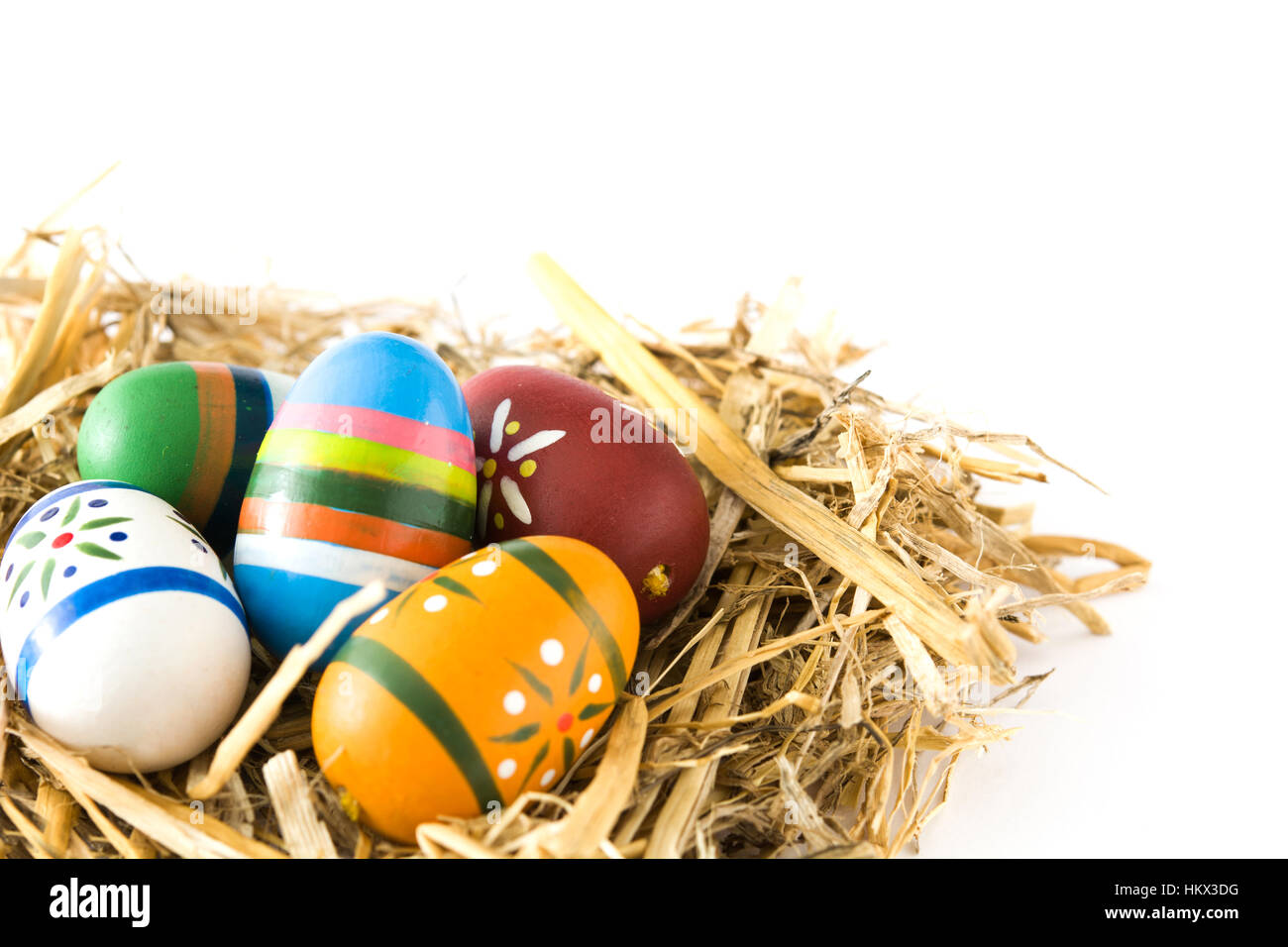 Easter eggs in a nest isolated on white background Stock Photo - Alamy