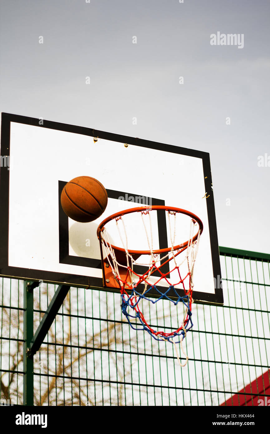 Basketball hoop outside in a school play area Stock Photo