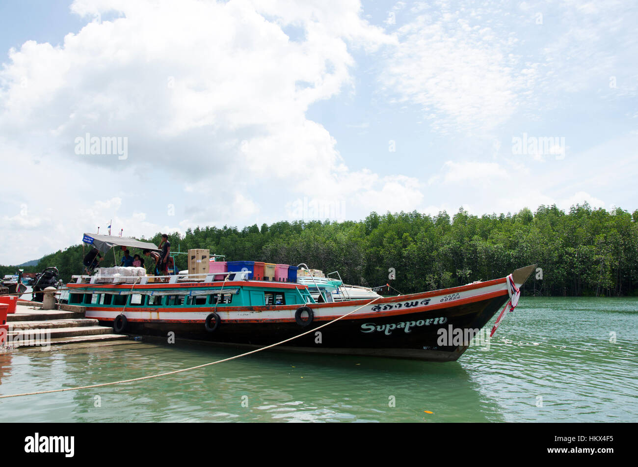 Thai people passengers and foreigner travelers walking up and down boat at Bang Rong Pier at Phuket for travel go to Koh Yao Noi Stock Photo