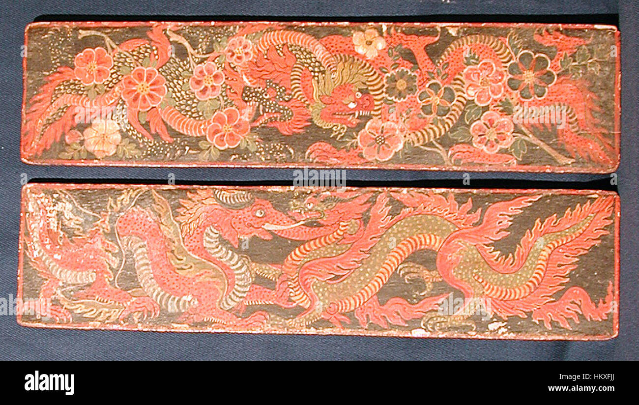 This image showcases a collection of Buddhist manuscript covers from India, dating back to ancient times. These intricately designed covers are part of a larger collection, emphasizing the importance of Buddhist scriptures and the role of art in preserving religious texts. Stock Photo