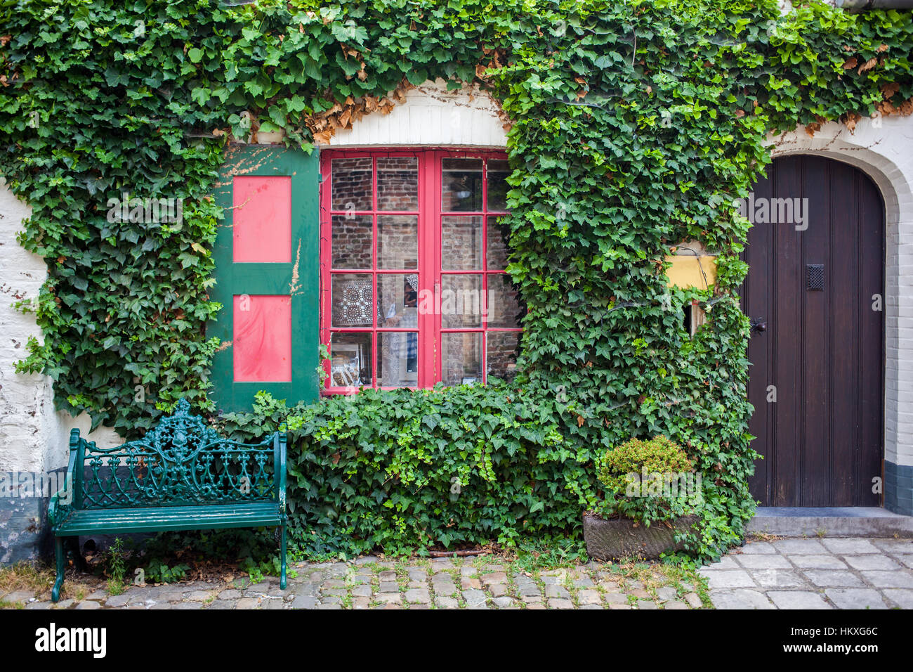 vintage bench near wall, in front of the window Stock Photo - Alamy