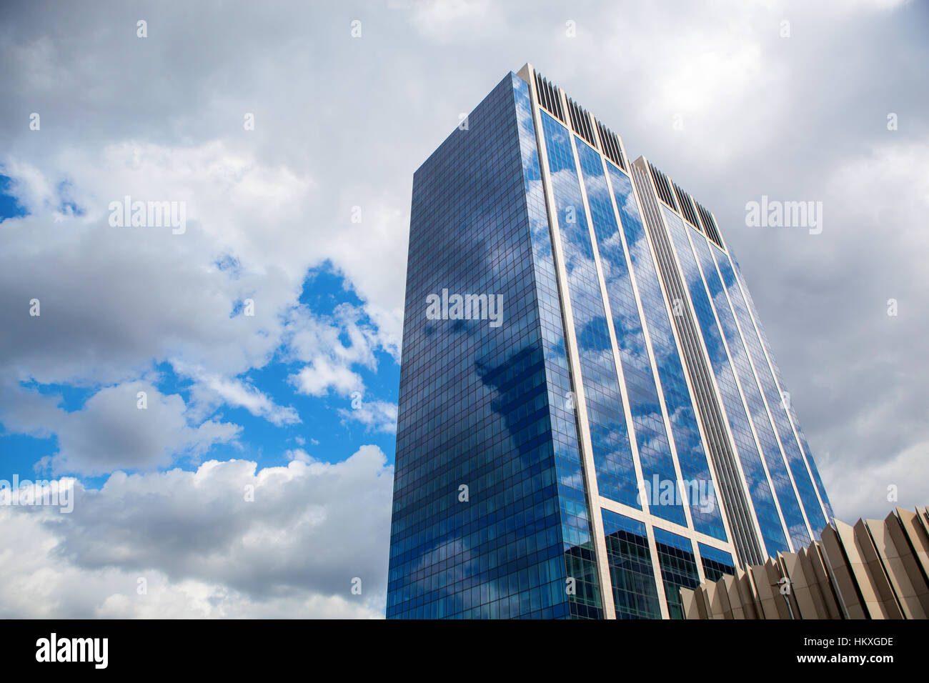 Modern building with reflection of blue sky and clouds Stock Photo - Alamy