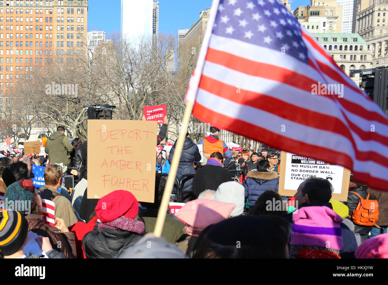 New York, United States. 29th Jan, 2017. New Yorkers rallied in Battery Park concerned about the recent ban on refugees, and Muslims by Donald Trump. They want to send a message that immigrants, and refugees are welcome here; and will protect the rights of everybody. Credit: Robert K. Chin/Pacific Press/Alamy Live News Stock Photo