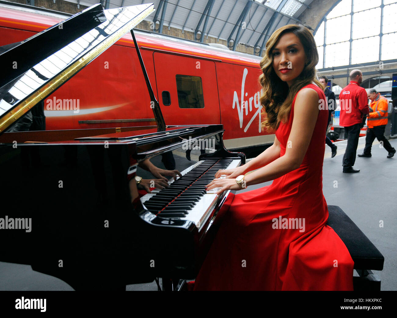 Myleene Klass gives a live piano performance on a baby grand piano at  King's Cross station, London, to mark the completion of a £40million  investment by Virgin Trains in its fleet of