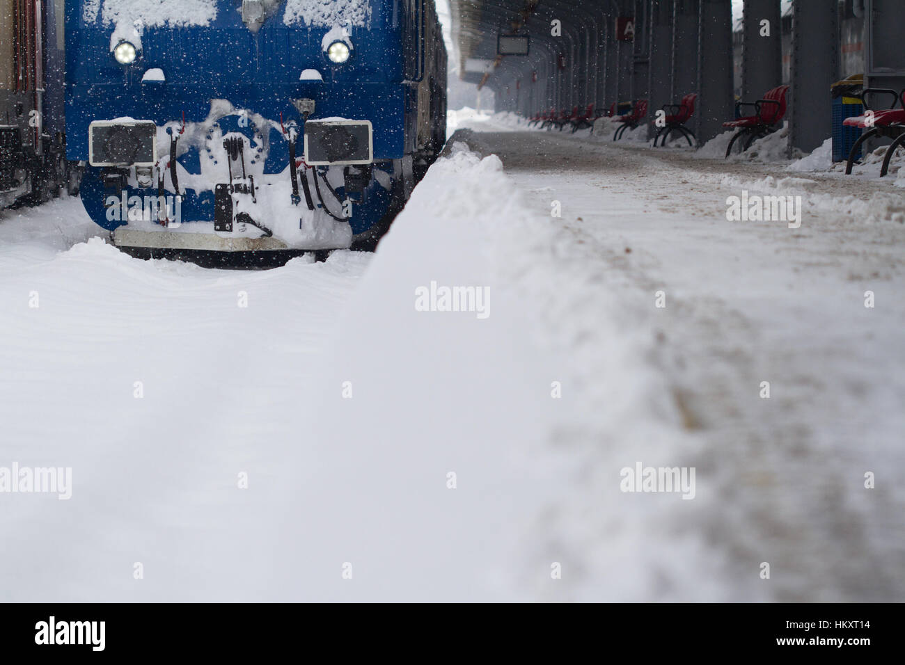 perspective front view of a blue locomotive of a passenger train ...