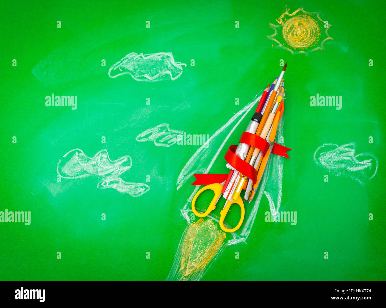 Rocket made from School supplies on Green chalkboard " Back to school ...