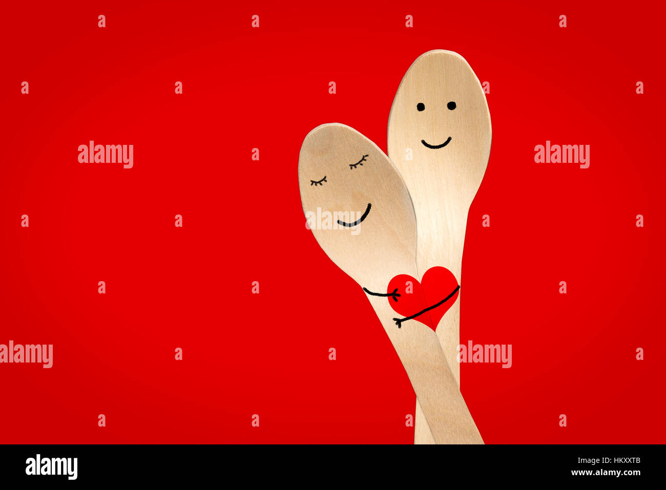 Happy couple hug concept, smiley painted on spoons, valentines day ...