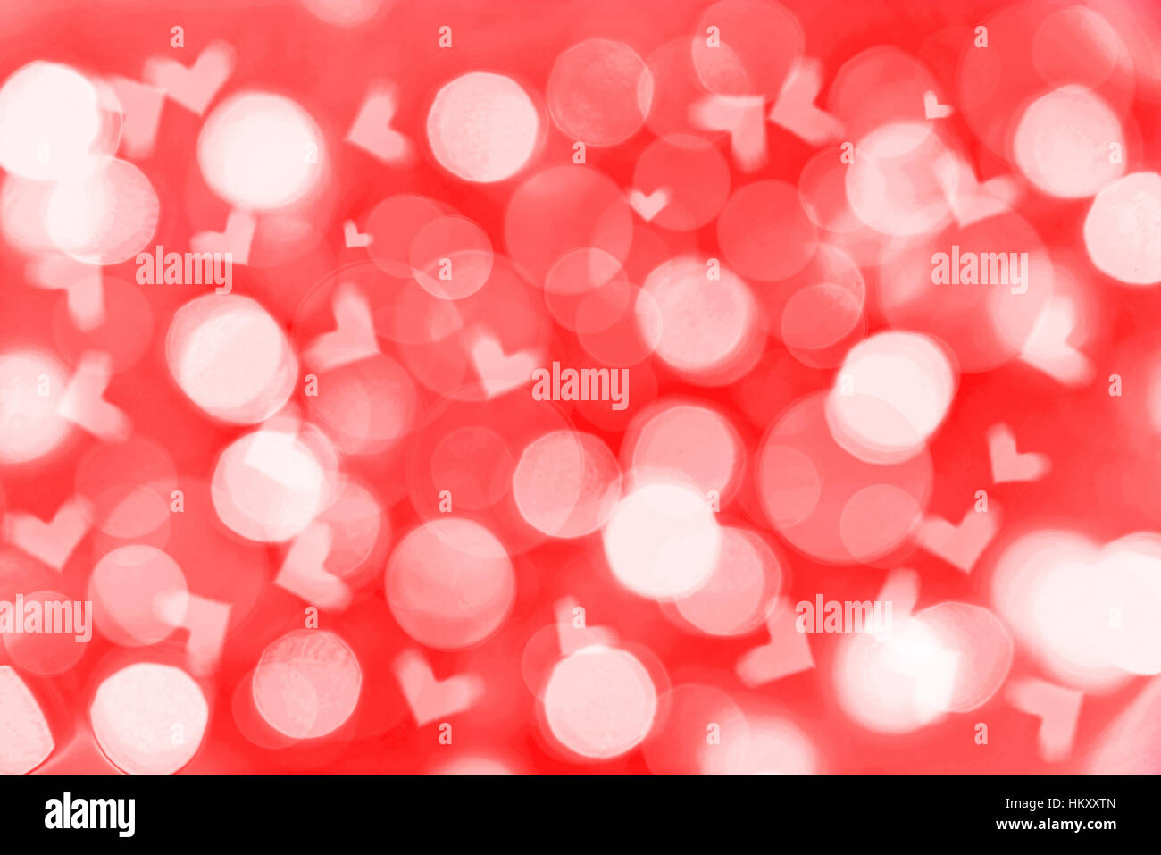 Valentines day holiday red background with blurred bokeh lights and hearts Stock Photo