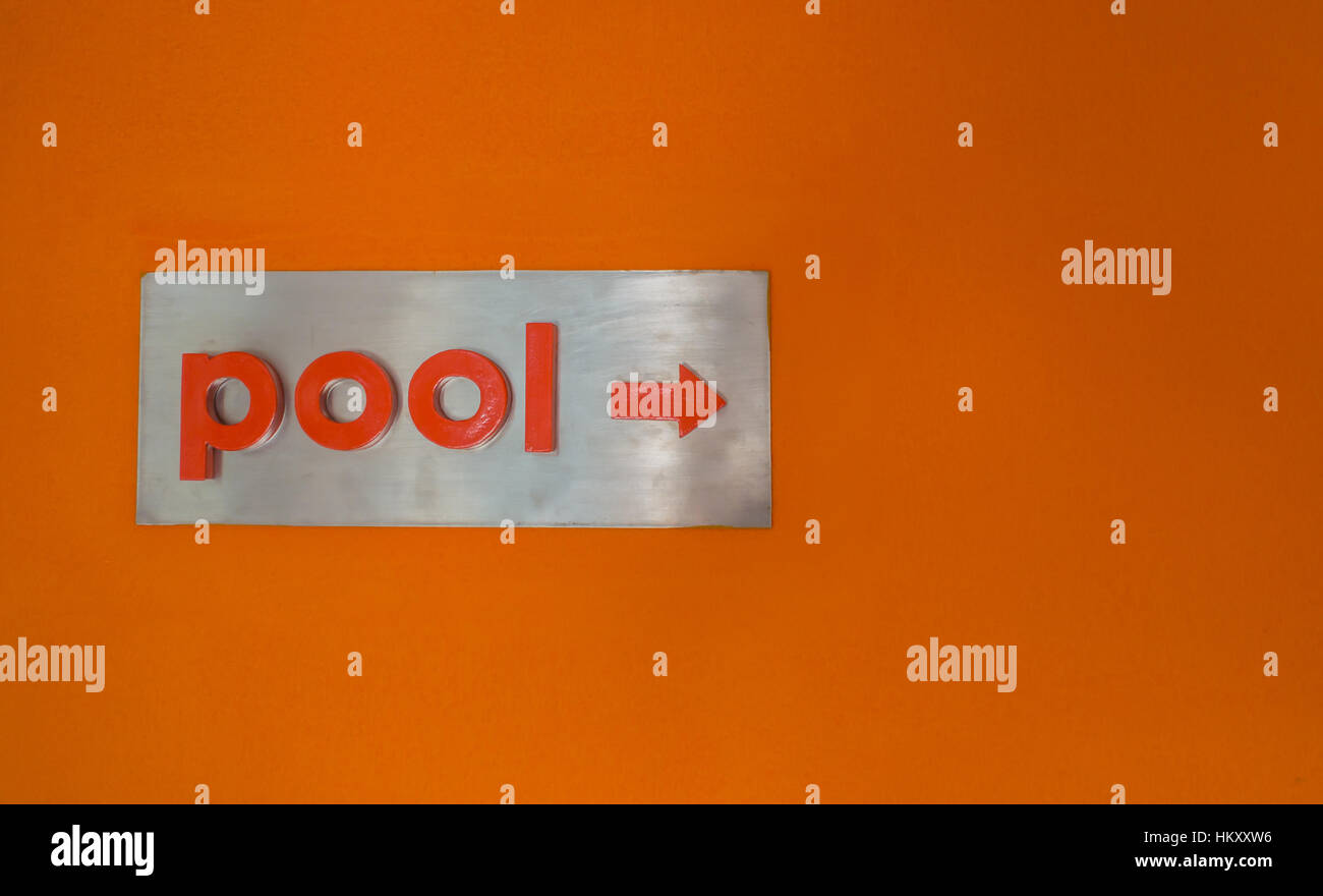 Pool direction sign on wall Stock Photo Alamy