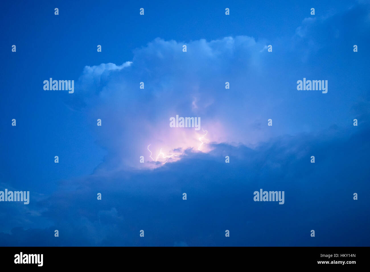 Lightnings in storm clouds. Peals of a thunder and the sparkling ...