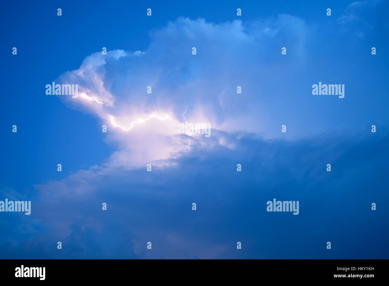 Lightnings in storm clouds. Peals of a thunder and the sparkling ...
