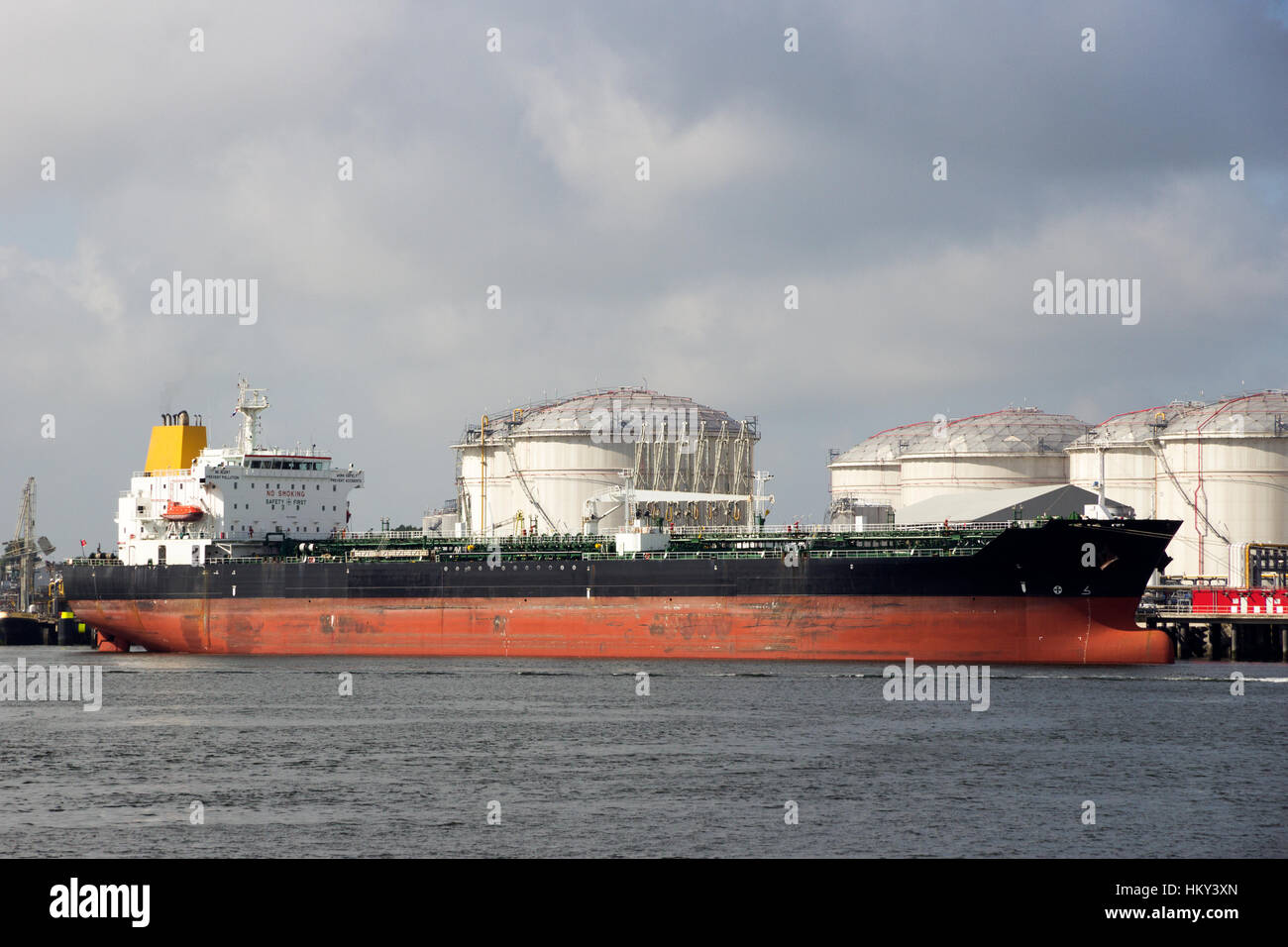 Oil tanker moored at an oil terminal. Stock Photo
